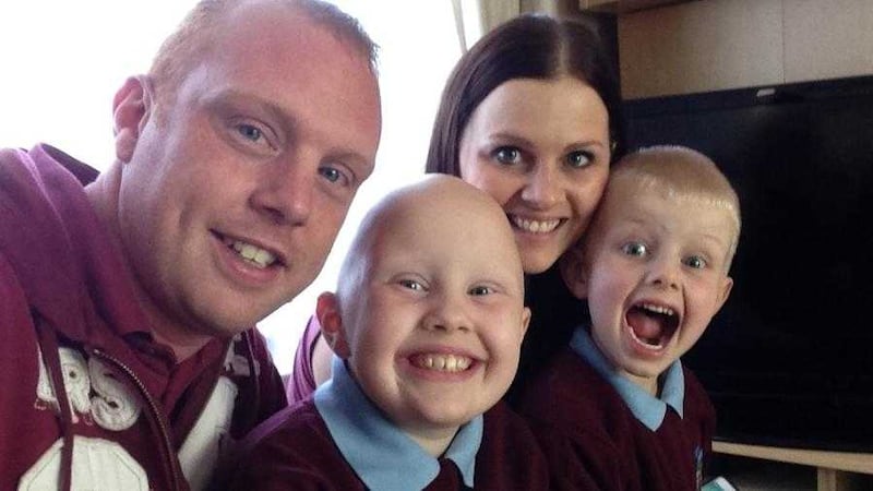Greyabbey girl Eden Long, who has alopecia, pictured with her dad Gareth, brother Cohen and mum Christine 