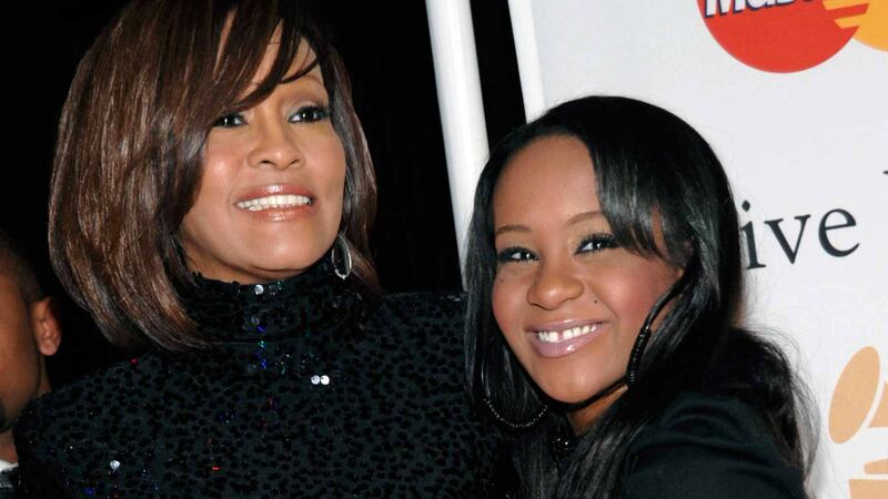 Whitney Houston and daughter Bobbi Kristina Brown arriving at an event in Beverly Hills, California in 2011