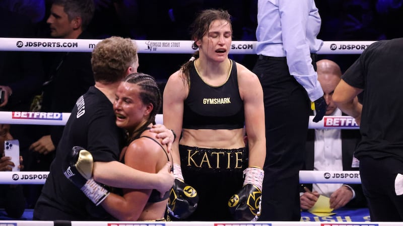 A crestfallen Katie Taylor reacts to her first loss as a professional as Chantelle Cameron celebrates 