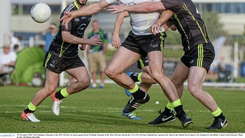 Neil Gallagher (Donegal) of the 2015 All Stars in action against Ryan McHugh (Donegal) of the 2016 All Stars during the GAA GPA All-Stars football tour sponsored by Opel at the Sheikh Zayed Sports City Stadium in Abu Dhabi, United Arab Emirates 