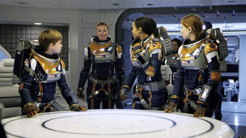 Lost in Space stars (l-r) Max Jenkins as Will Robinson, Molly Parker as Maureen Robinson, Taylor Russell as Judy Robinson, Parker Posey as Dr. Smith and Mina Sundwall as Penny Robinson 