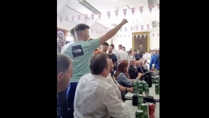 A still from a video showing people in Dundonald Orange Hall singing about the death of Michaela McAreavey 