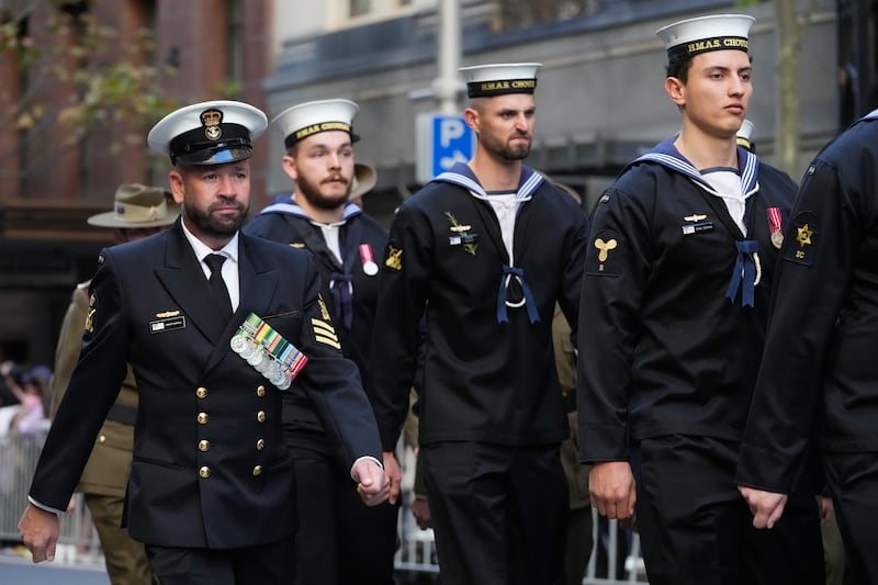 Navy personnel march during the Anzac Day parade in the central business district of Sydney (Mark Baker/AP)
