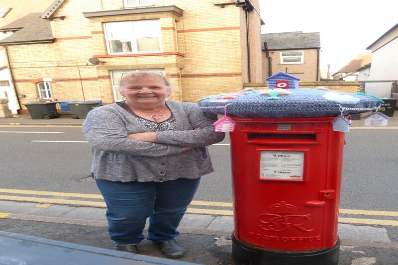 Rachel Williamson, a retired police officer, has been making postbox toppers in Rhyl, Wales, during the coronavirus pandemic