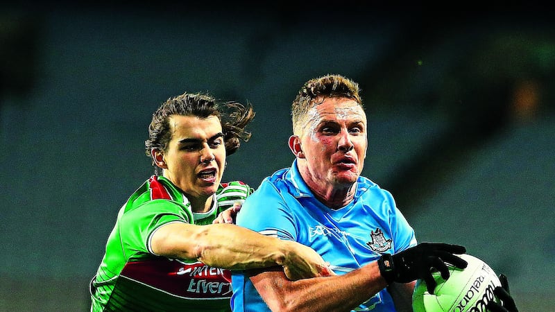 Oisin Mullin challenges Ciaran Kilkenny during last year's All-Ireland final. Mullin's injury is a huge blow to Mayo's hopes today.