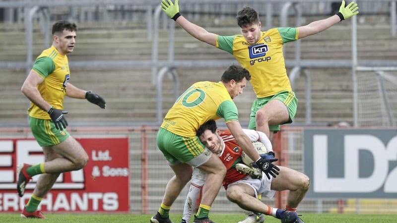 Armagh forward Jamie Clarke is crowded out by Donegal&rsquo;s Paul Brennan and Brendan McCole during yesterday&rsquo;s McKenna Cup semi-final in Omagh Picture by Margaret McLaughlin 