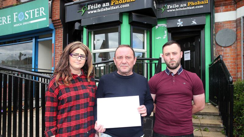 IRSP members Aisling McLaughlin, Michael Kelly and Gerard Foster prepare hand over a letter of protest to the organisers of F&eacute;ile an Phobail  