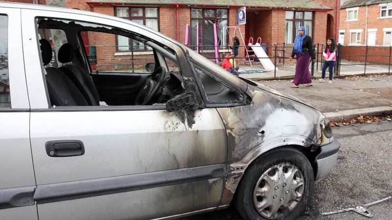 A Kuwaiti family&#39;s car burnt out in a hate attack at Ulsterville Avenue, Belfast, in 2014. Picture by Cliff Donaldson 