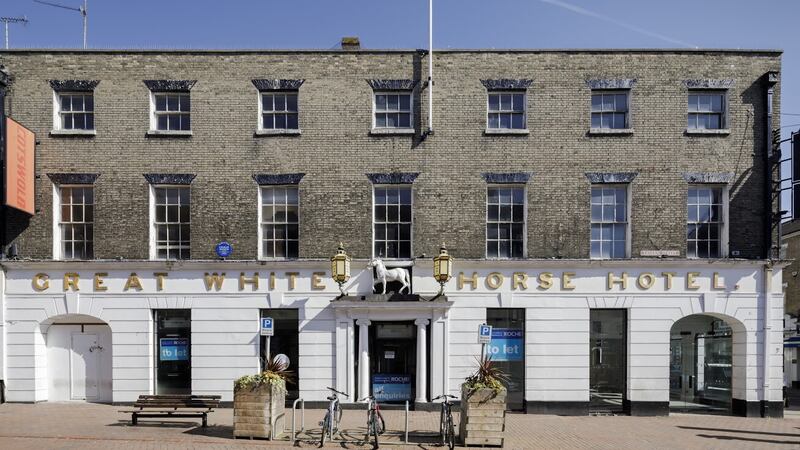 The Great White Horse Hotel in Suffolk has been named among the 159 sites on Historic England’s at risk list (Heritage England/PA)