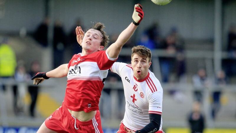 Tyrone's Conall McCann competing against Derry's Jason Rocks in the Bank of Ireland Dr McKenna Cup semi-final.<br /> Pic Philip Walsh