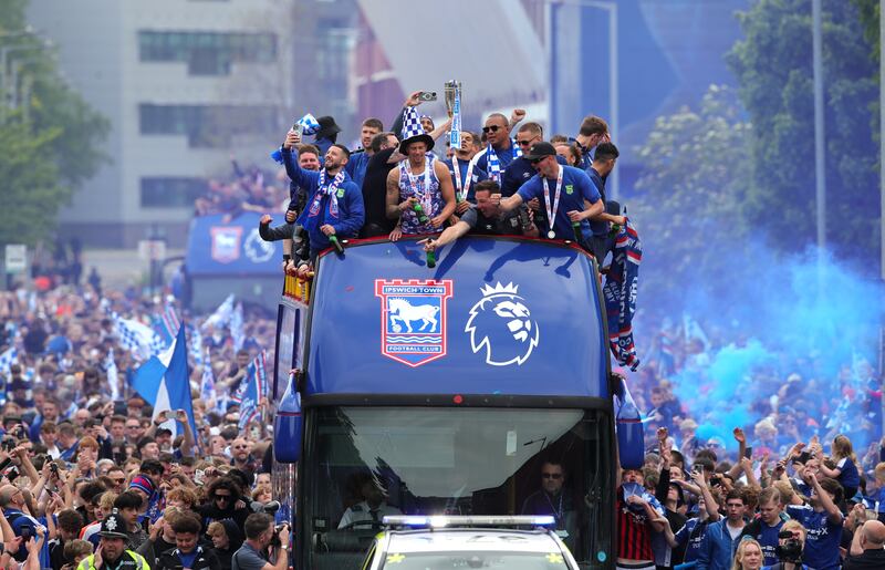 Ipswich celebrated their promotion to the top-flight with a bus tour on Monday