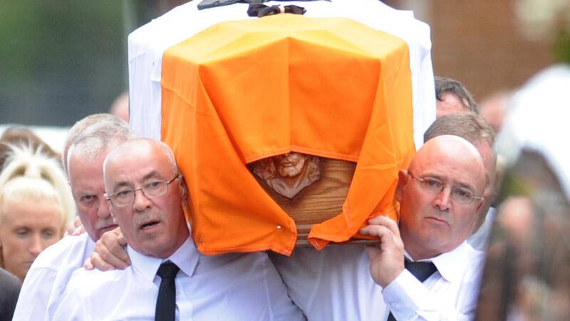 Mourners carry Gerard &#39;Jock&#39; Davison&#39;s coffin during his funeral 