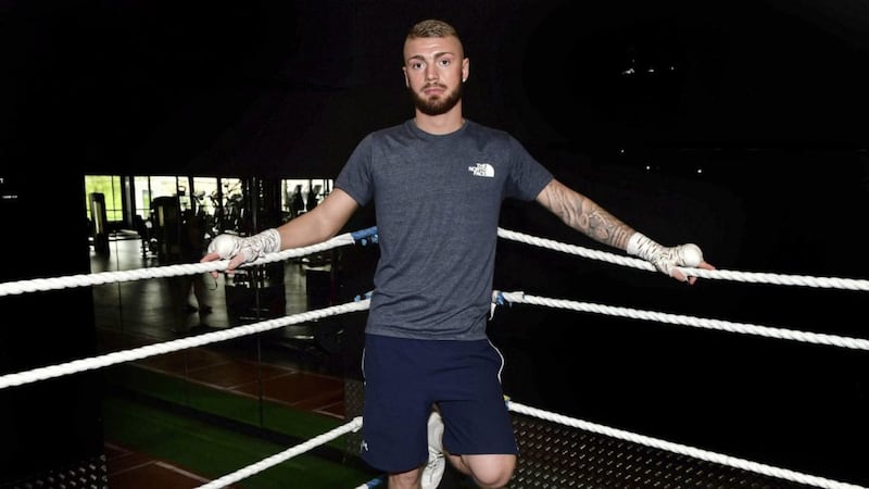 Boxer Lewis Crocker has been awarded more than &pound;8,000 in a fair employment case 