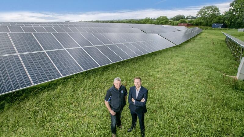Pictured at the solar farm at Dale Farm&rsquo;s Dunmanbridge cheese facility are Chris McAlinden, group operations director alongside farmer David Beggs, one of the Dale Farm&#39;s cooperative members, who supplies the company with milk from his farm nearby in Cookstown. 