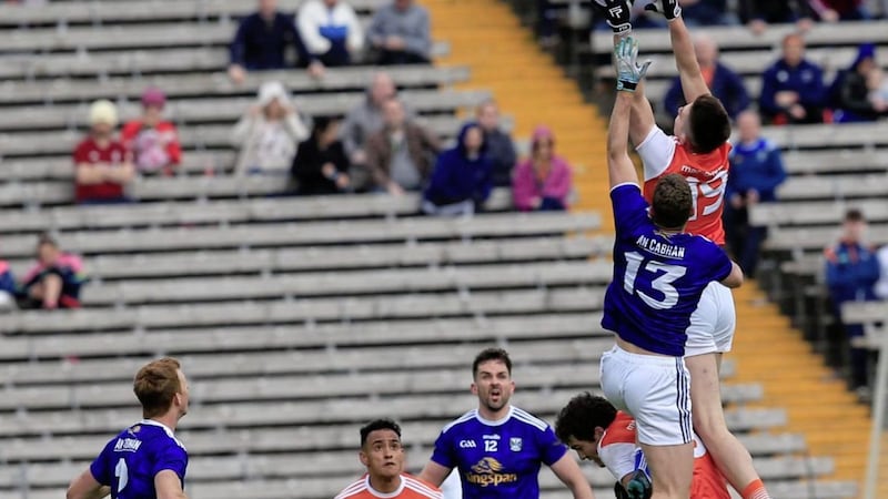 Safe hands. Ben Crealey out-jumps Cavan&#39;s Gearoid McKiernan during last year&#39;s Ulster Senior Football Championship semi-final at Clones. Picture by Philip Walsh. 