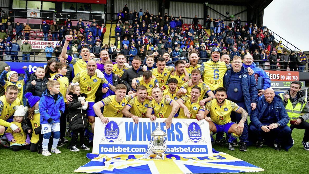 Bangor celebrate winning the Steel &amp; Sons Cup on Christmas Eve at Seaview 