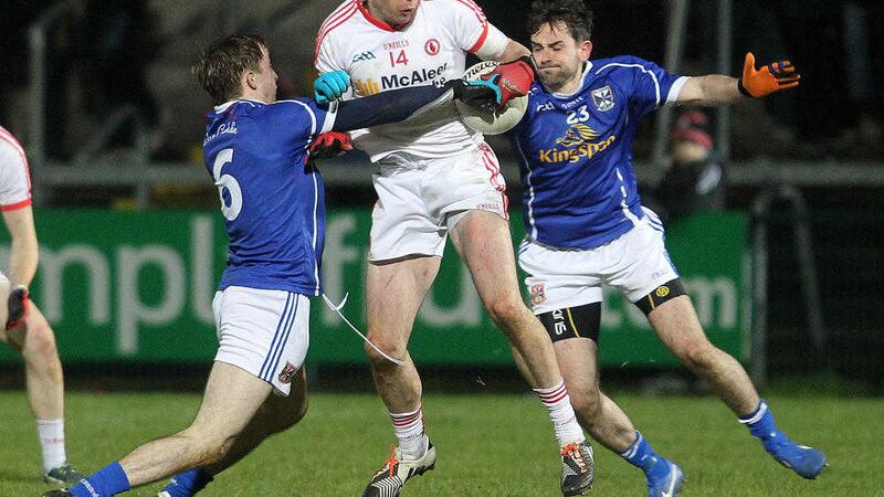 Tyrone captain Sean Cavanagh keeps a firm grip despite the close attention of Cavan's Paul Smith and Niall Murray in last year's Dr McKenna Cup final.&nbsp;Who won and what was the final score?