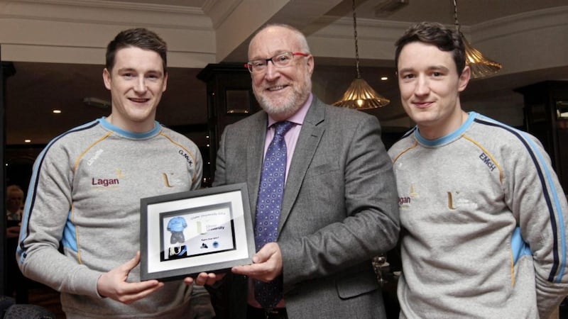Ulster University players Gareth McKinless and Eoin McHugh accept a memento for winning last year&#39;s Ryan Cup from Ulster HE GAA chairman Peter Finn. Pic: Ann McManus  