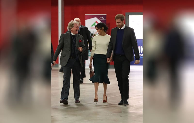 The Reverend Dr David Latimer walks with Prince Harry and Meghan Markle during a visit to the Eikon Exhibition Centre in Lisburn. Picture by Niall Carson, PA