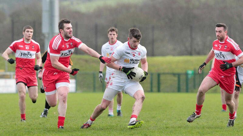 Richard Donnelly takes on Derry&#39;s Mark Lynch during Tyrone&#39;s win over their rivals on Sunday. Donnelly hit four points from play in a man of the match display. Picture by Margaret McLaughlin 