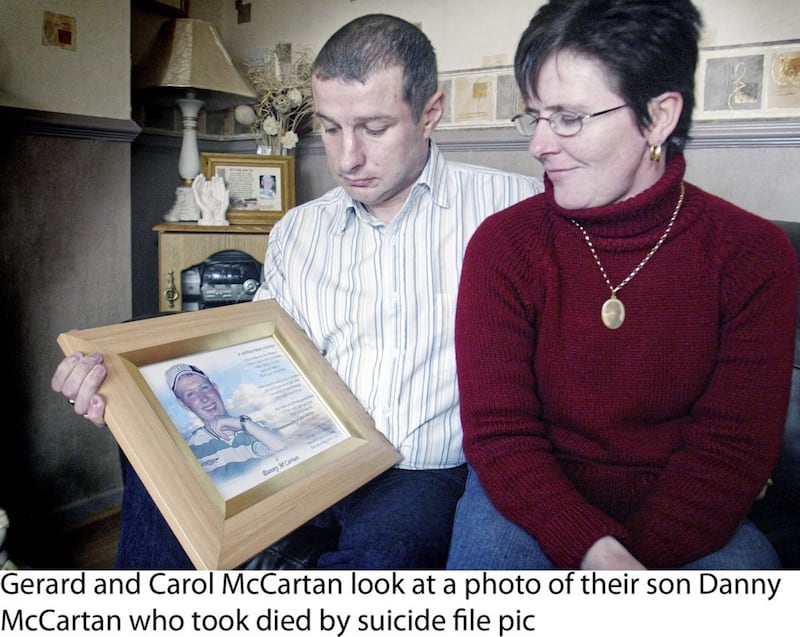 Gerard and Carol McCartan pictured in 2007 looking at a photo of their son Danny McCartan who took died by suicide .  Picture Colm O&#39;Reilly 