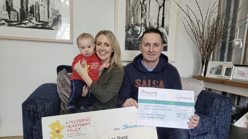 Sonia Daly and James Conway are pictured with their son Jamie Joe presenting &pound;18,500 for their chosen charities, Children&rsquo;s Heartbeat Trust and Children&rsquo;s Health Foundation following their charity GAA match at Ballinderry Shamrocks GAA in November 
