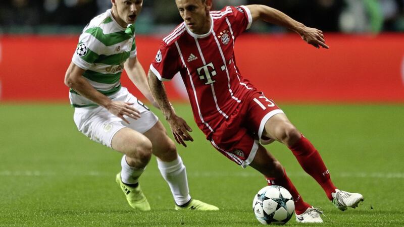 Kieran Tierney challenges Bayern Munich&#39;s Marcio Rafinha during the Uefa Champions League, Group B match at Celtic Park on Tuesday 