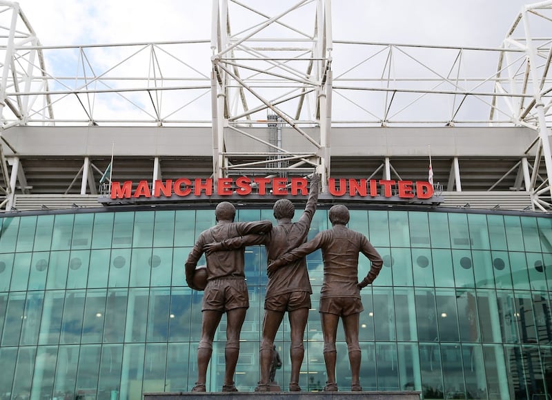 A statue of Manchester United’s ‘Holy Trinity’ of Sir Bobby Charlton, George Best and Denis Law stands outside Old Trafford