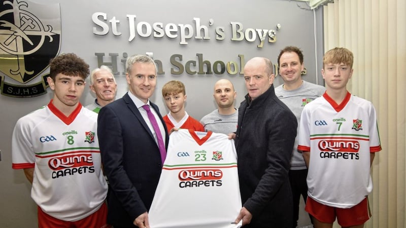 <span style="color: rgb(51, 51, 51); font-family: sans-serif, Arial, Verdana, &quot;Trebuchet MS&quot;; ">Donal Quinn of Quinn's Carpet, Newry pictured with St Joseph's High School, Newry principal Declan Murray, Head of PE Fergal Rogers and PE teachers Damian Brady and Steven Poacher along with pupils at the launch of the school's new GAA jersey.</span>
