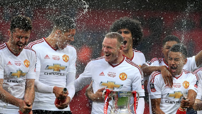 &nbsp;Saturday's triumph over Crystal Palace was Rooney's first FA Cup trophy<br />Picture by PA