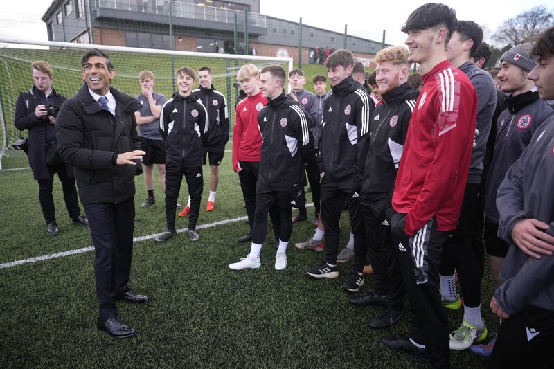 Prime Minister Rishi Sunak speaks to young football players during a visit to Accrington Stanley Community Trust in Lancashire