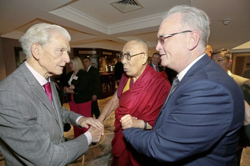 Children In Crossfire Compassion in Action Conference. His Holiness the 14th Dalai Lama is greeted by members of the Children in Crossfire Board including Jim Fitzpatrick together with Richard Moore at the Compassion in Action Conference lunch in Derry on Sunday. Photo by Lorcan Doherty