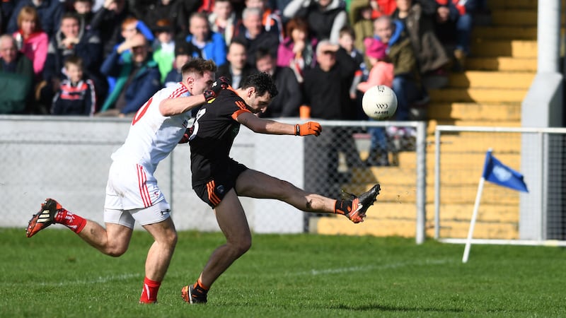 Armagh's Jamie Clarke has a shot while under pressure from Louth's James Stewart during Sunday's Allianz Football League Division Three clash in Drogheda<br />Picture: Ian Maginness&nbsp;