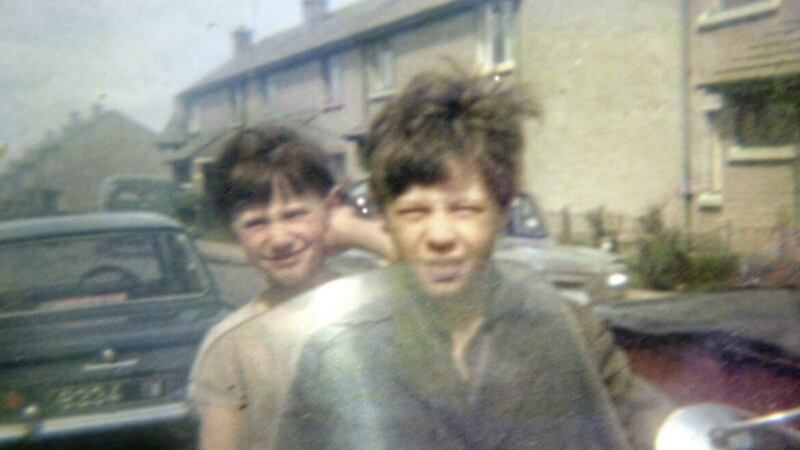 Daniel Hegarty pictured with his sister Kathleen sitting on a motorbike in the Creggan Estate 