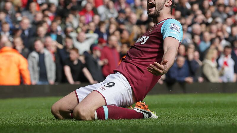 West Ham's Andy Carroll celebrates scoring his second goal in a 3-3 thriller against Arsenal on Saturday