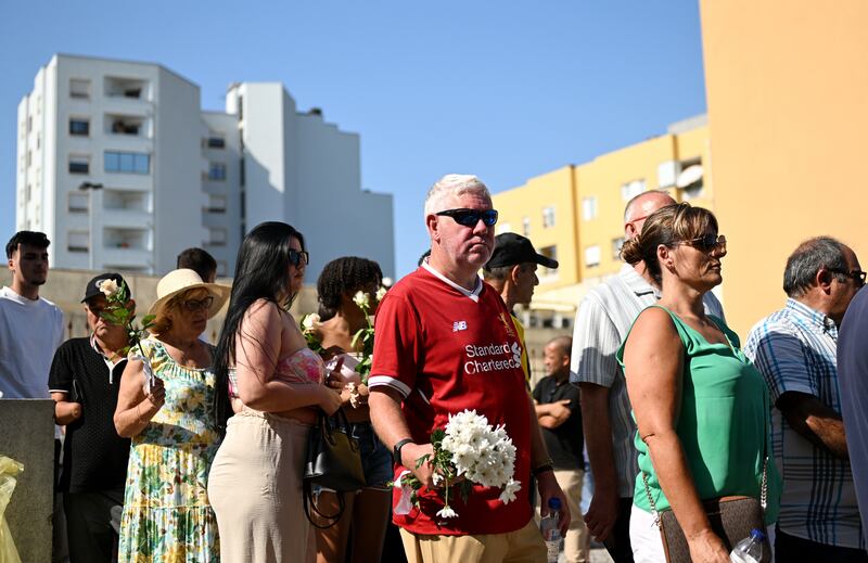 One man wore a Liverpool shirt to pay his respects