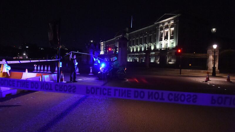 A suspect is being questioned by counter-terror police after he was armed with a sword outside the royal residence.