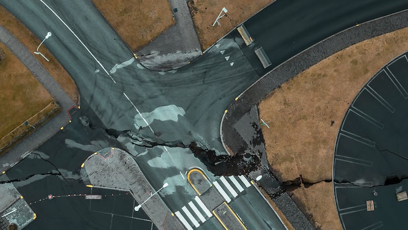 Cracks at an intersection in the town of Grindavik (Bjorn Steinbekk/AP)