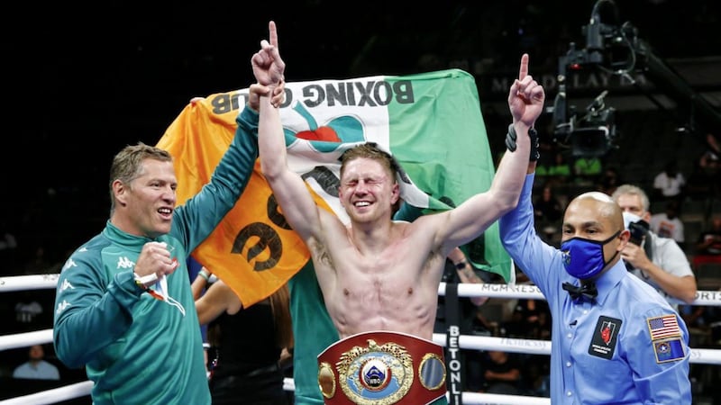 Jason Quigley celebrates after defeating Shane Mosley Junior by majority decision in Las Vegas in May 