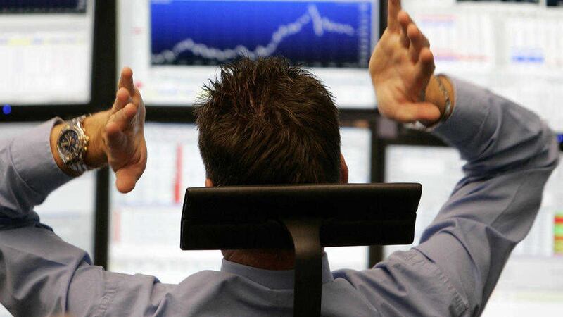 A broker is seen at the stock market in Frankfurt central Germany Monday Oct. 13 2008. (AP Photo/Michael Probst) 