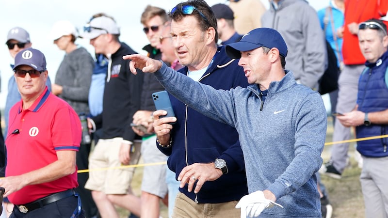 Sir Nick Faldo, left, wants Rory McIlroy to act as if he ‘owns the ring’ as he bids to win a second Open title at Royal Liverpool (Jane Barlow/PA)