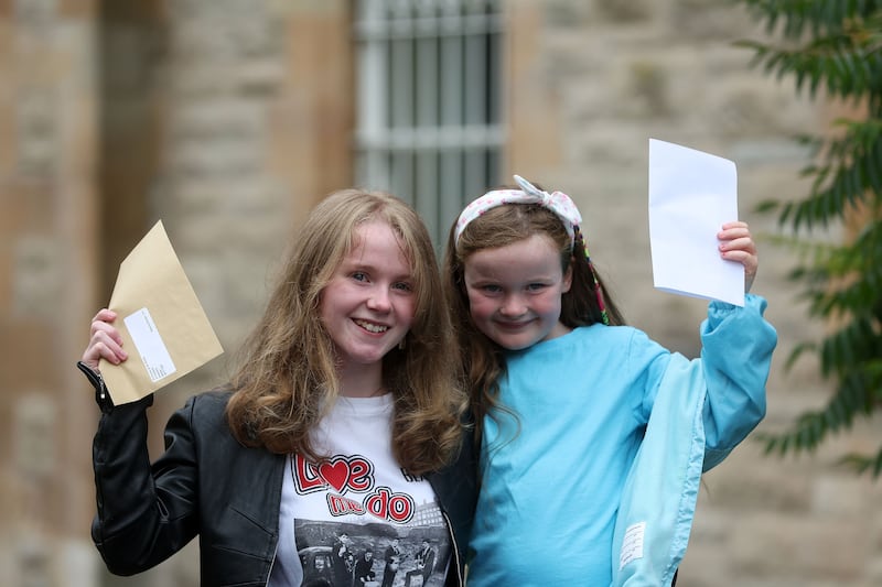 Rebecca Donna and her young sister Eimear celebrate on collecting Rececca's A-Level results from St Dominics. Picture Mal McCann