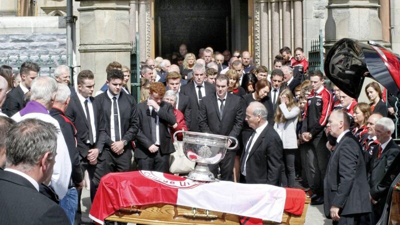<span style="font-size: small; font-family: Arial, Verdana, sans-serif;">The coffin of Pat Darcy, former Chairman of Tyrone County Board, is draped with the Tyrone flag and the Sam Maguire</span>