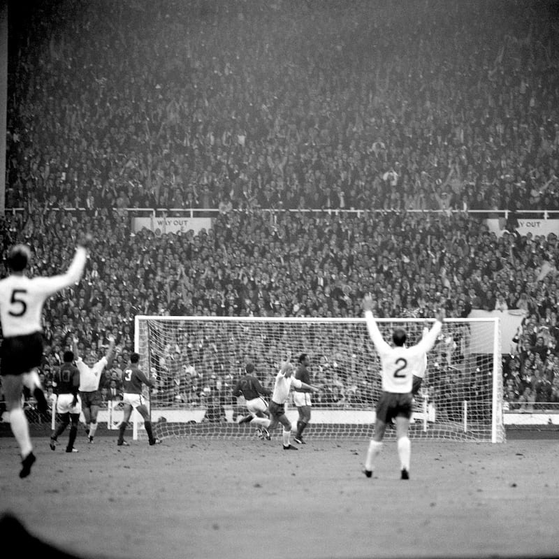 Bobby Charlton turns to celebrate opening the scoring against Portugal in the semi-finals of the 1966 World Cup