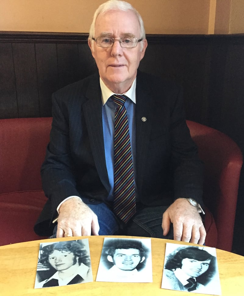Eugene Reavey with pictures of his brothers (left to right) Anthony, John Martin and Brian, who were killed by a loyalist murder squad in 1976