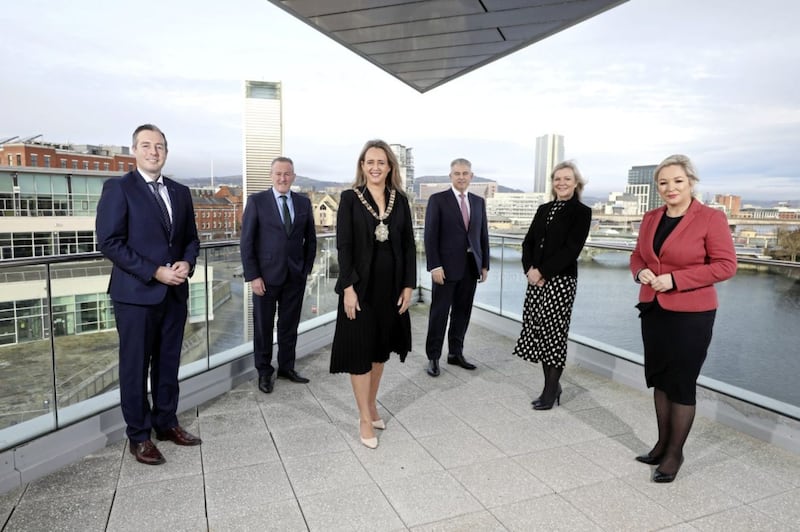 L-R: First Minister Paul Givan; Finance Minister Conor Murphy; Belfast Lord Mayor, Cllr Kate Nicholl; NI Secretary of State Brandon Lewis; chair of the Belfast Region City Deal executive board, Suzanne Wylie; and Deputy First Minister Michelle O&rsquo;Neill. 