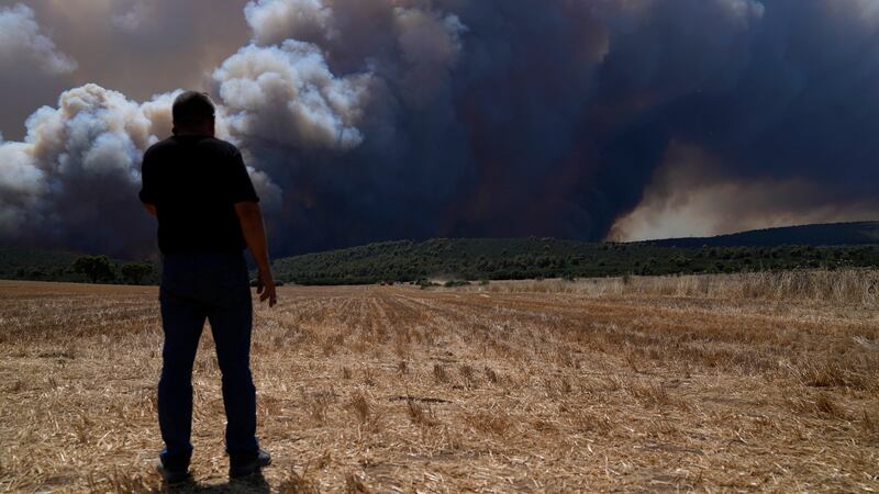 Severe heat in July helped wildfires spread across Greece (Thanassis Stavrakis/AP/PA)