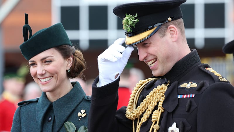 The Duchess of Cambridge wore a sprig of shamrock on her coat while William, dressed in military attire, had a sprig in his cap.