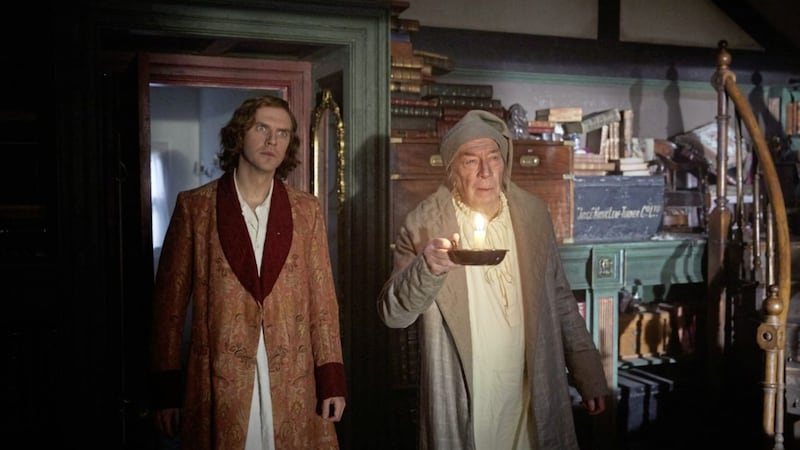 Dan Stevens as Charles Dickens and Christopher Plummer as Ebenezer Scrooge in The Man Who Invented Christmas 