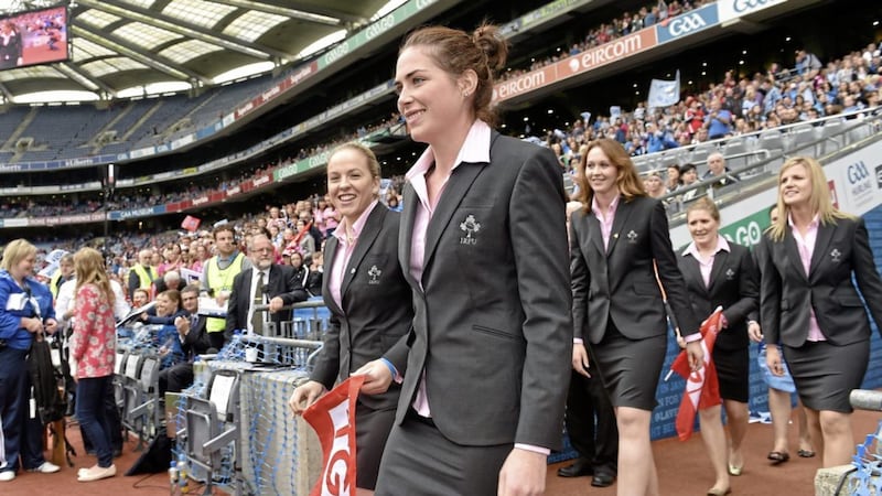 Nora Stapleton (centre) alongside other members of the Ireland Women&#39;s rugby team at the 2014 TG4 All-Ireland Ladies Football Senior Championship Final in Croke Park. 